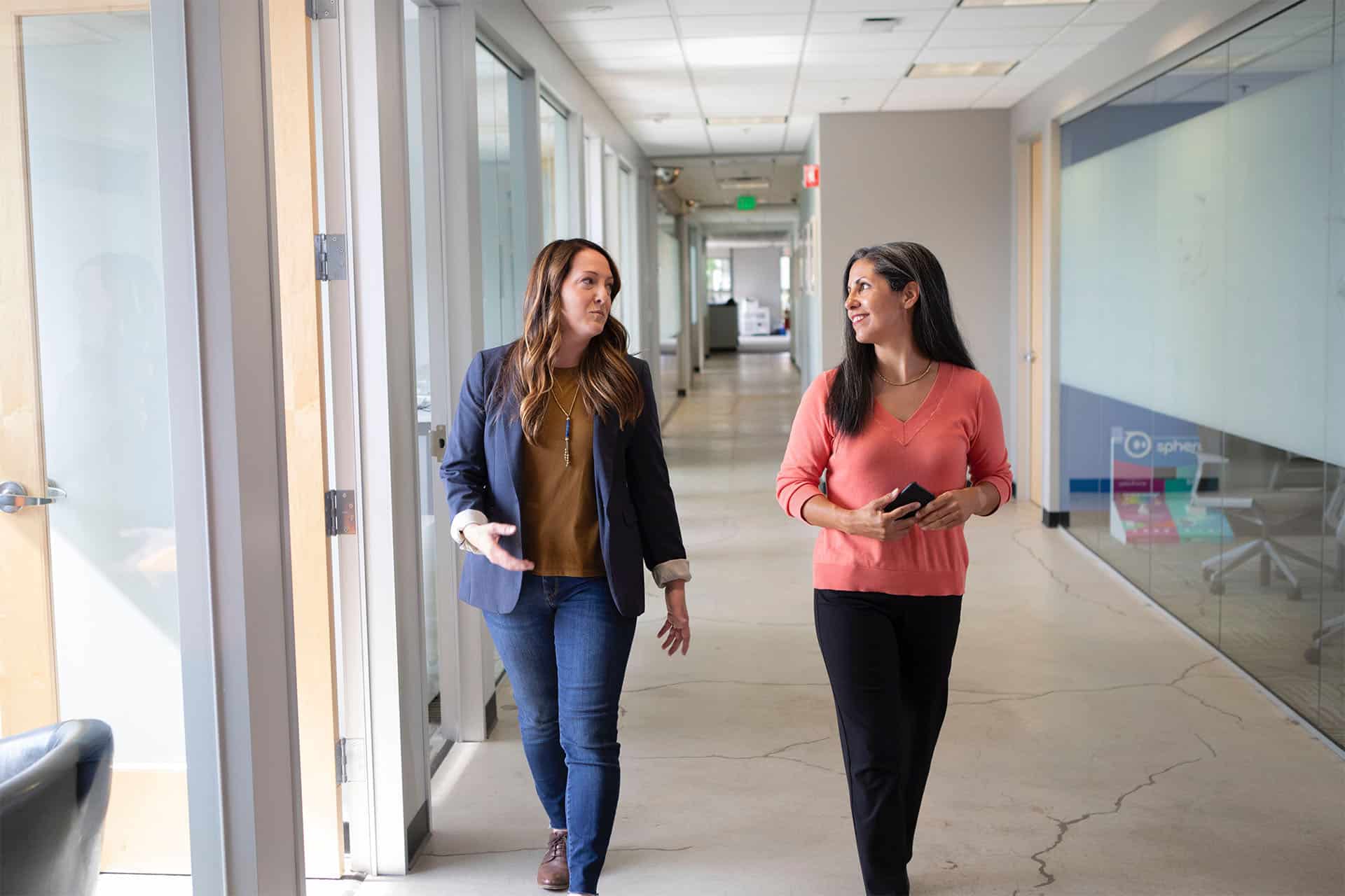 A business advisor walking and talking with a client