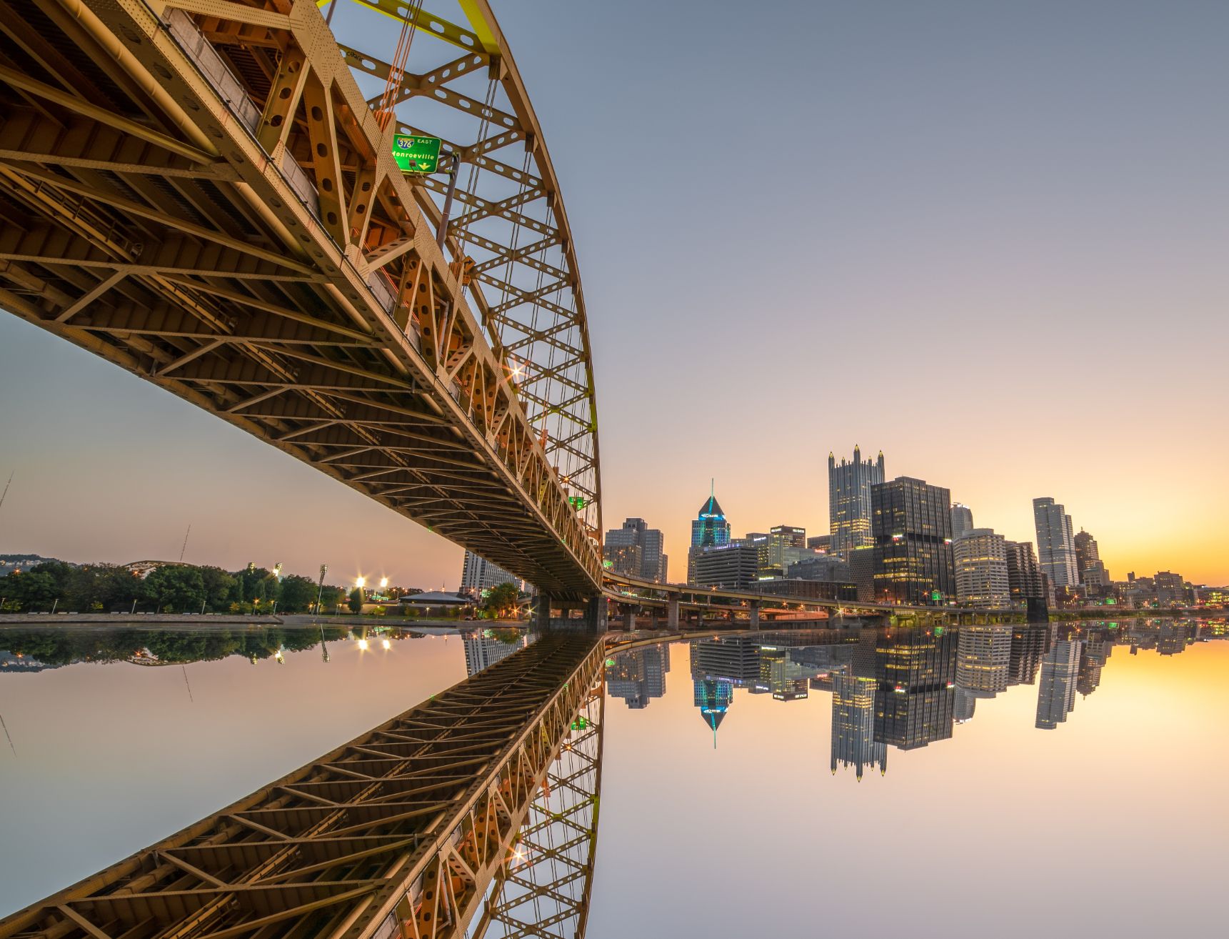 view below a bridge along the water in pittsburgh